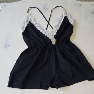 Black criss cross back romper with lace detail